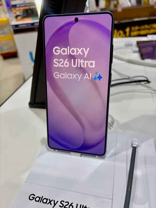 Samsung Galaxy S26 Ultra with its S Pen, front view on a display stand