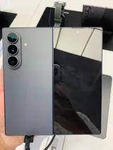 Rear of a Samsung Galaxy Z Fold8 Ultra in graphite, unfolded flat with its triple camera