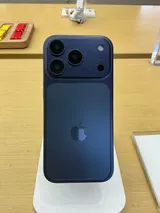 Apple iPhone 17 Pro in deep blue, rear view on a display stand