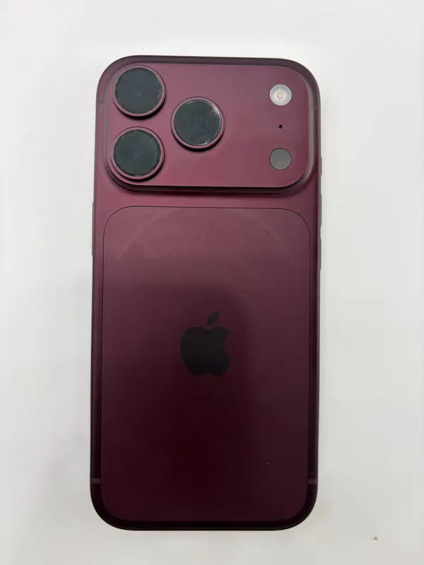 Rear of an Apple iPhone 18 Pro Max in dark red