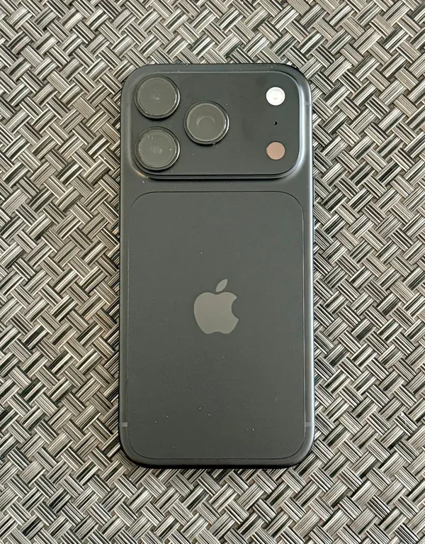 Rear of a black Apple iPhone 18 Pro on a textured mat