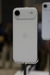 Apple iPhone Air in light gold, rear view on a display stand